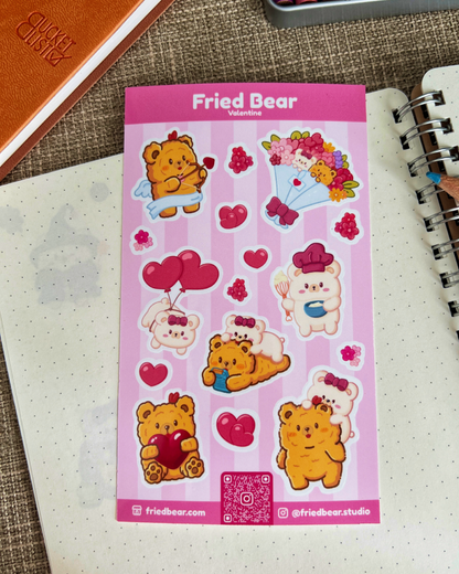 Fried Bear Valentine sticker sheet with hearts, balloons and a bouquet lying on a dotted notebook